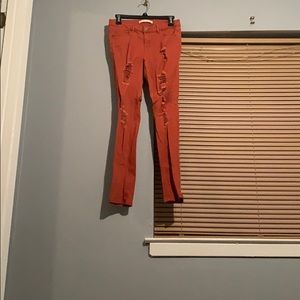 Bunt orange ripped skinny jeans